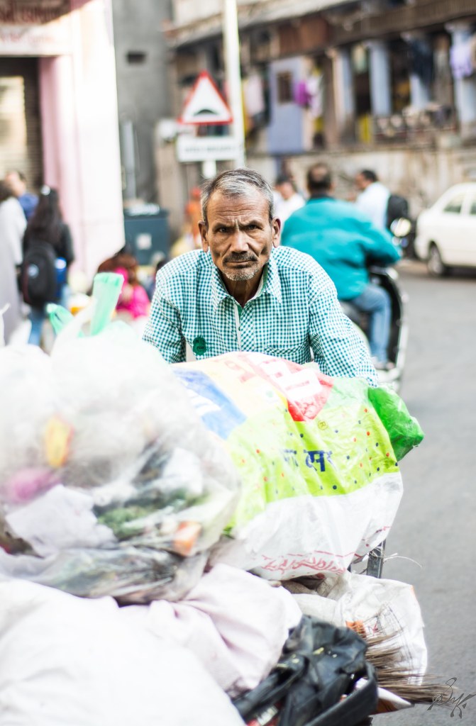 Garbage collector on his early morning routine rounds