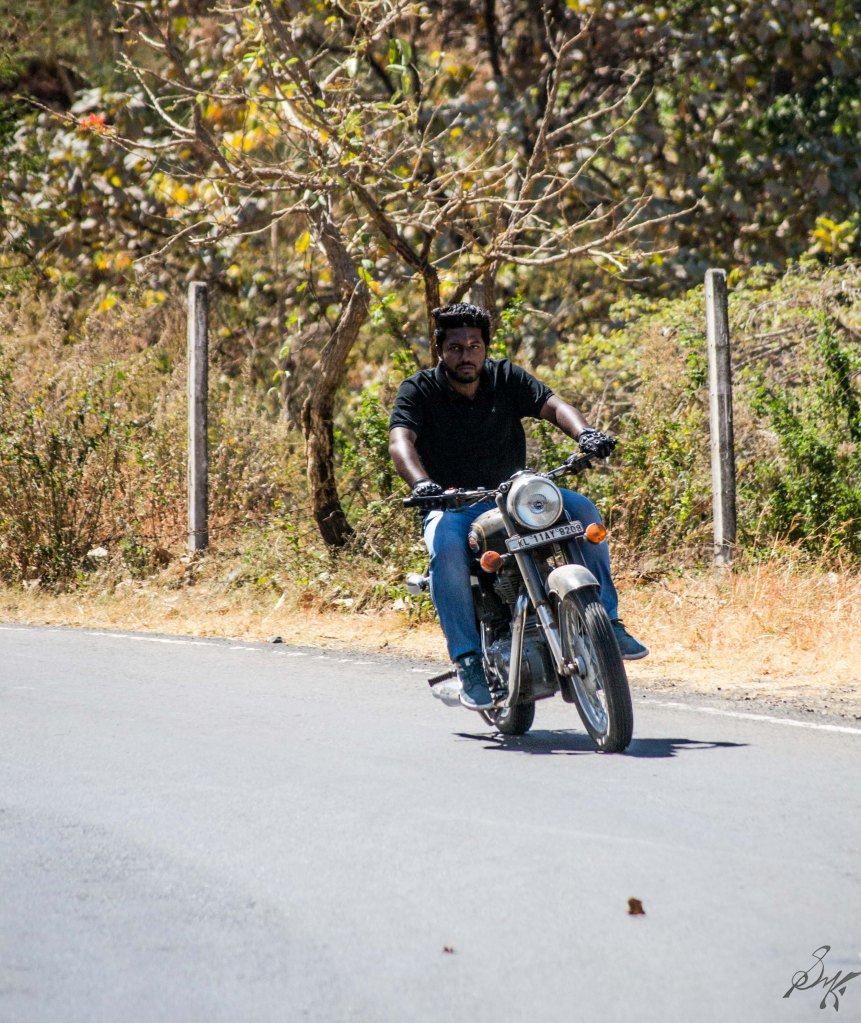 Man on Royal Enfield Bullet taking a turn