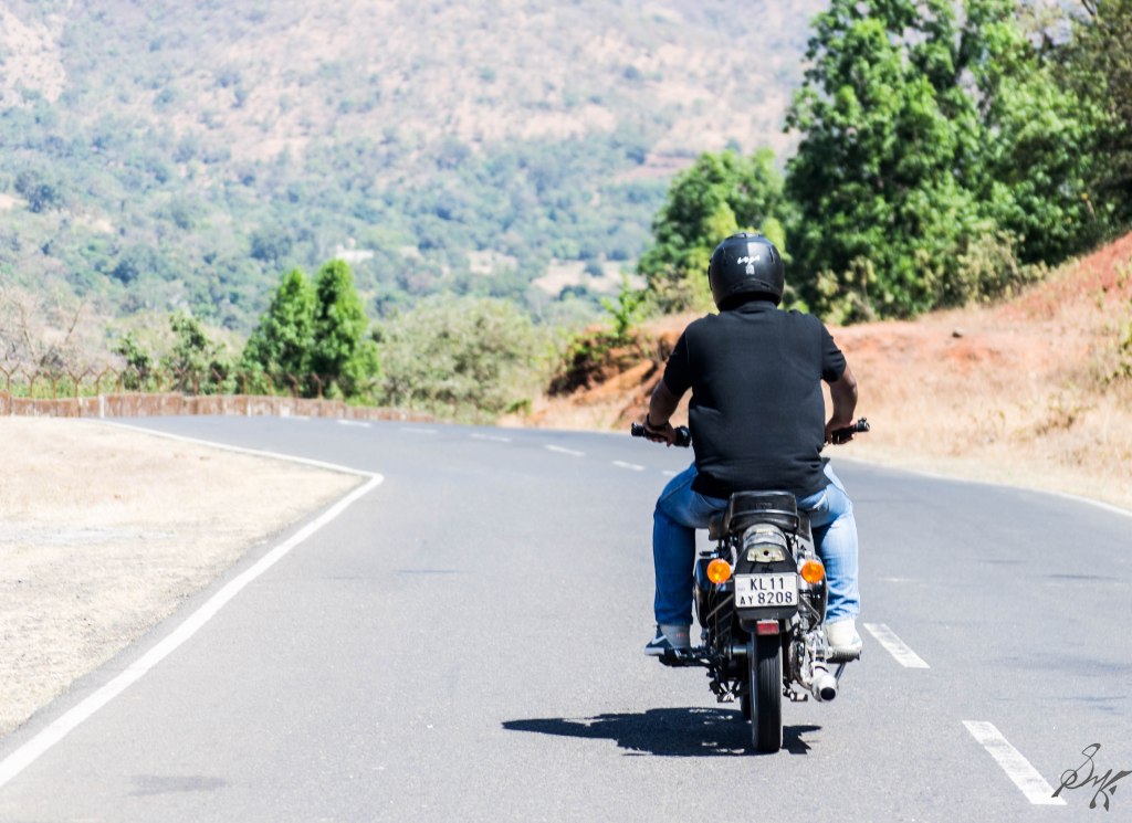 Man on a bike in an empty road