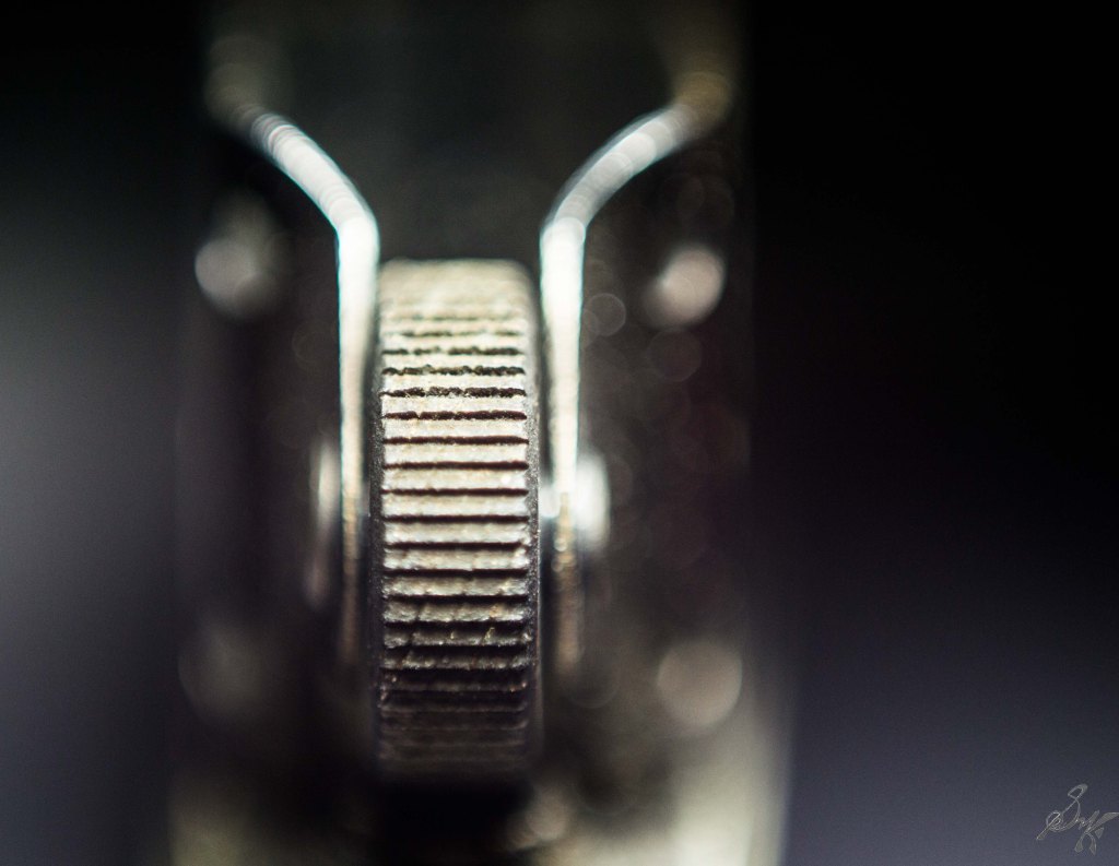 macro close up of the striking wheel of a zippo lighter