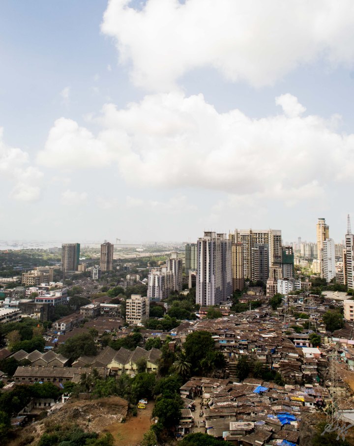slums and high rise buildings sea ships and the sky, Mumbai, India