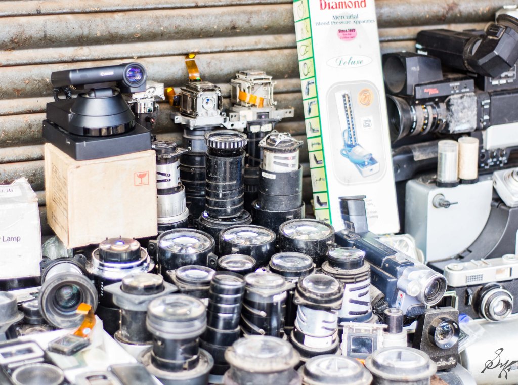 Various camera lenses for sale on the roadside 