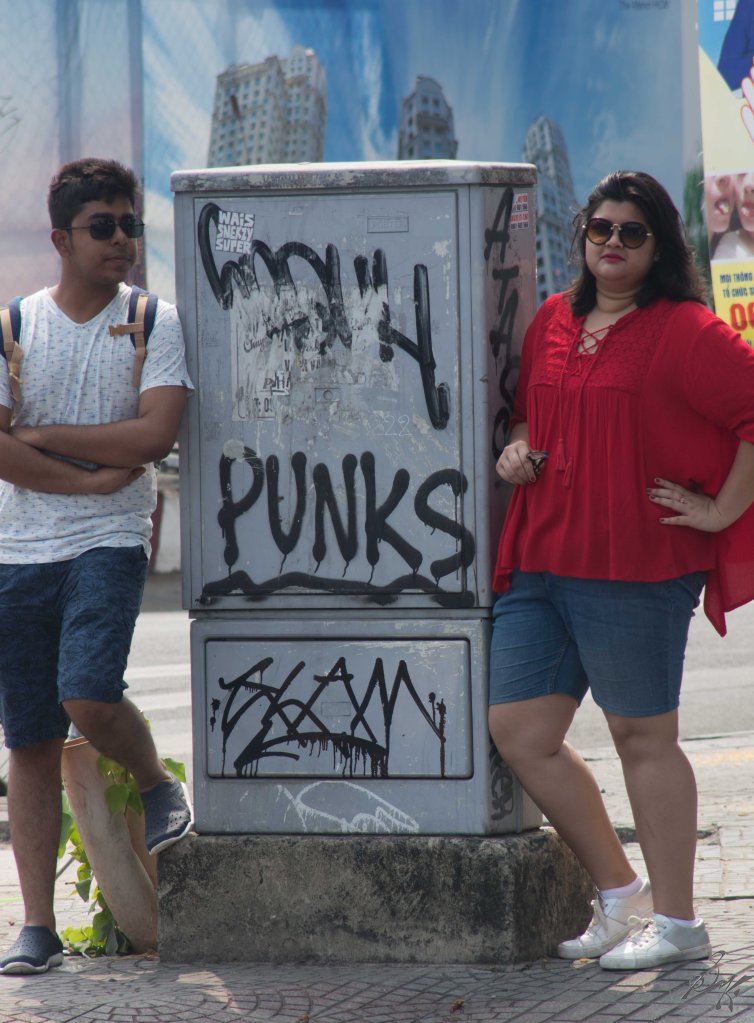Friends posing with a graffity