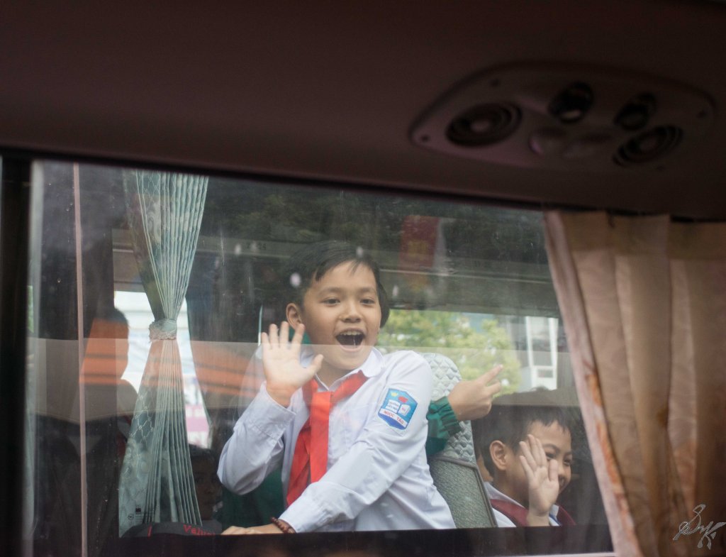 Happy kids waving at us, Hanoi, Vietnam